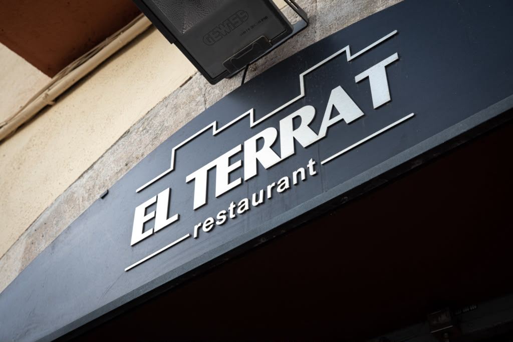 The sign on the façade of El Terrat Restaurant